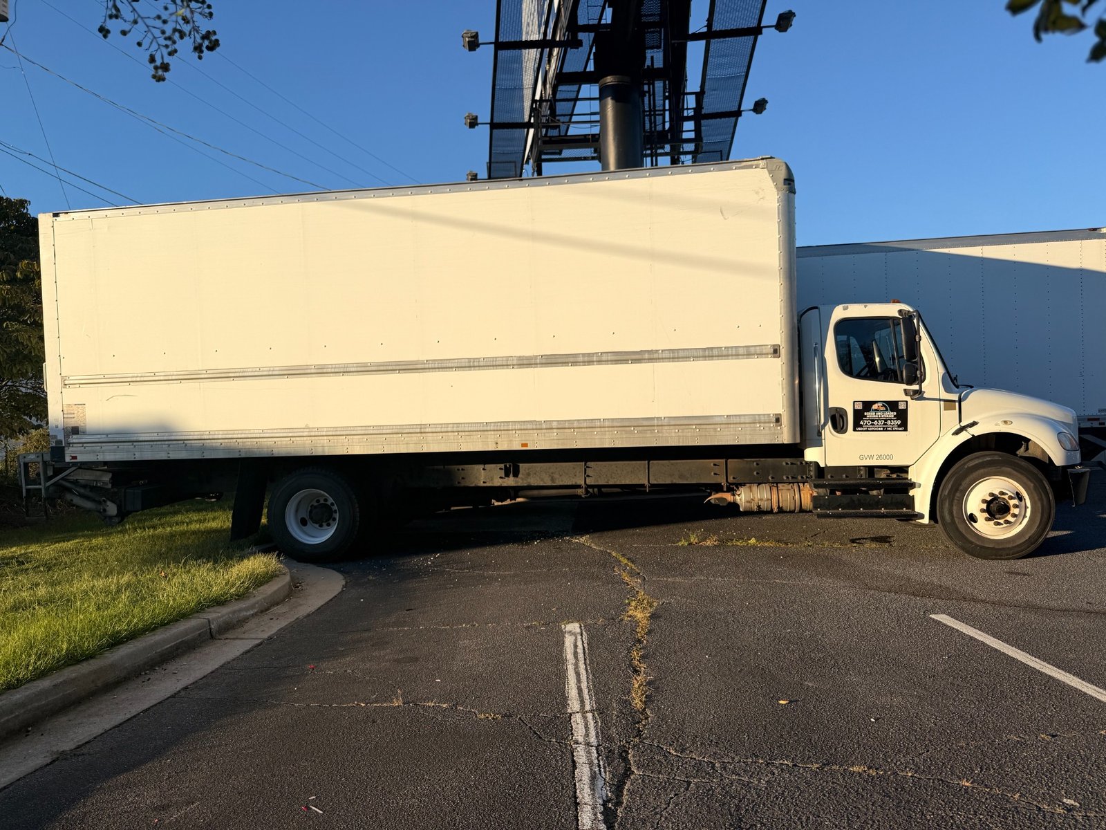 Boxed and Loaded branded white moving truck ready for a Georgia move
