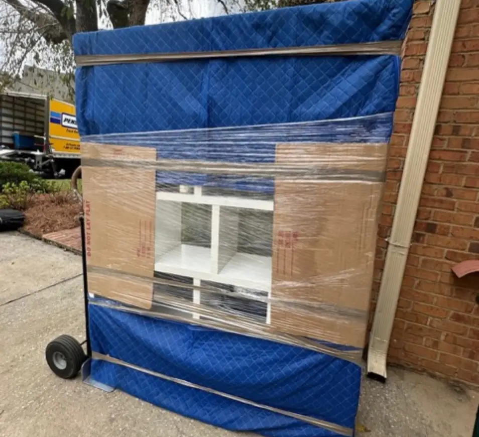 bulky furniture wrapped for moving